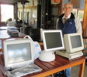 Dr Peter Bilenkij with three generations of Apple computers. 